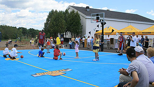 Dedicated on Aug. 24, the Woolwich, Maine, community now has a new and improved basketball court. The QUIKRETE Companies repaved the old surface, provided new basketball goals, and completed a fresh paint job. Photo courtesy of The QUIKRETE Companies.