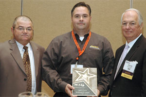 MCAA Membership Committee Chairman Tony DeNegri (left) and MCAA President Frank Campitelli (right) present QUIKRETE with the 2007 Supplier of the Year award.