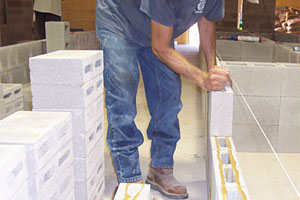 CMUs are staged with Mason Bond on the head joints and the bed joints. Within four hours of the blocks being set in place, the wall's strength is equal to that of a wall with fully cured mortar.