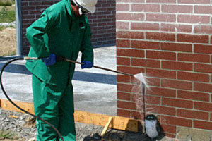 The correct way to clean a masonry wall is from the bottom up. This technique helps keep rundown from soaking in, which may cause hard-to-remove stains. Photo courtesy of Chris Millspaugh, PROSOCO.
