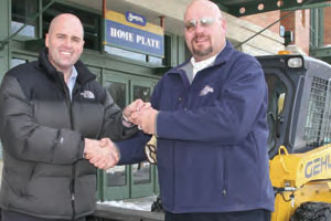 Pictured : Dan Keyes (on left), Gehl VP Sales and Marketing; and Bob Hallas, Director of Stadium Operations, Miller Park, Milwaukee Brewers Baseball Club