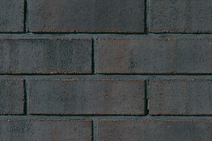 Hanson Brick's "Hibernia" brick is a black brick ideal for creating architectural accents on building. Coated in manganese to create its black colour, Hibernia has a leathery appearance and tiny hints of the red clay underneath. Image courtesy of Hanson Brick.