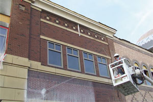 A technician from Sparklewash Construction Services, Omaha, Neb., cleans a mixed masonry façade. Cleaning exteriors that have mixed masonry of varying sensitivities can be tricky. The easiest thing to do is clean as soon as possible — before the excess mortar gets too hard — with a cleaner made for the most sensitive masonry in the wall. Photo courtesy of PROSOCO.