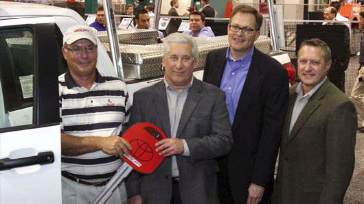 Shown left to right are Dave Dinkel, winner of the Toyota Tundra; Bill Zbylut, VP, marketing, Knaack LLC; Larry Zimmerer, national fleet accessory, commercial marketing manager, Toyota Motor Sales U.S.A.; and Jim Radous, VP, sales, Knaack LLC.