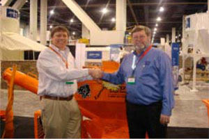 Damian Lang, CEO/President of EZ Grout Corporation (left) and Mike Howlett, President of the General Construction Equipment division of Multiquip Inc. (right) announce their partnership at the World of Concrete 2009 show in Las Vegas.