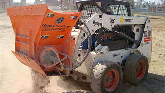 The Hog Crusher, an onsite recycling attachment to reduce jobsite waste.