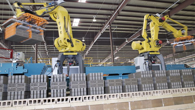 Lingl robots move brick from line to kiln cars.