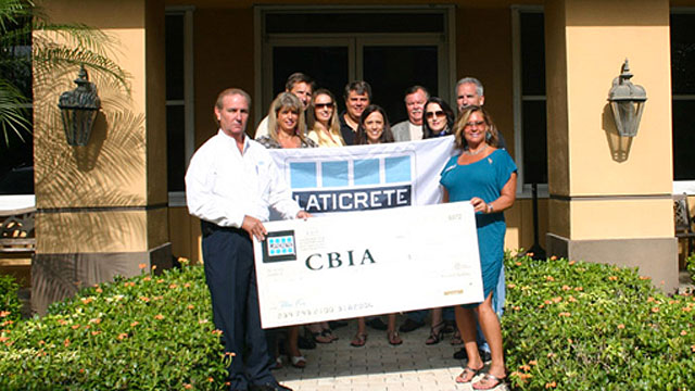 Pictured front (l to r): Tony Campos, LATICRETE technical sales rep, presents the check for the LATICRETE engraved brick to Juls Chambers, CBIA director of membership. Second row: Valerie Childs, Terrilyn Van Gorder, Barbie Rogers, Laura Johnston. Back: Carter Grant, David Aldrich (CBIA president), Tom Dardis, Patrick Henry (Daltile).