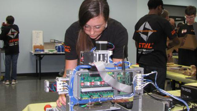 Rachael Lockwood uses a 3-axis CNC engraving mill at the Manufacturing Technology Summer Camp.