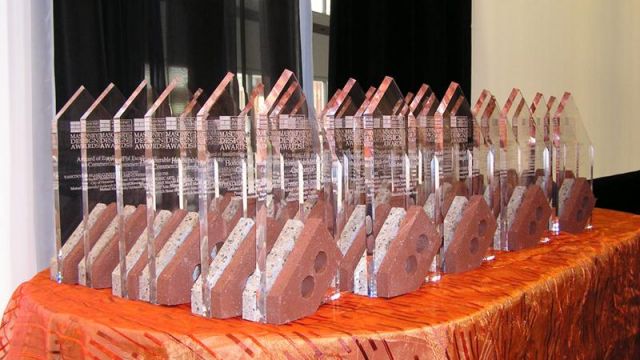 The unique masonry award trophies are made of engraved acrylic supported by brick and block slices