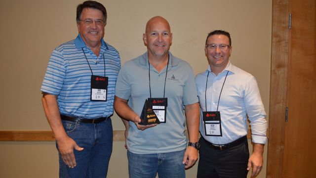 Robert Gates (left) and Mike Cook (center) are presented the MCAA Safety Advantage Award by Jack West (Federated Insurance).