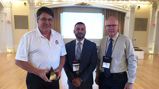 Bob Gates (left) is presented the MCAA Safety Advantage Award by Armand Cruz of Federated Insurance (center) with Paul Odom (right).