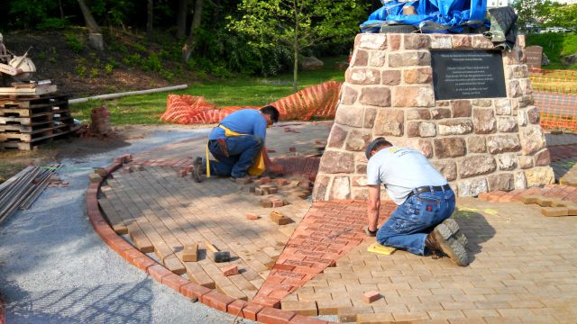 The plaza incorporates more than 1,000 tan- and red-colored brick pavers. 