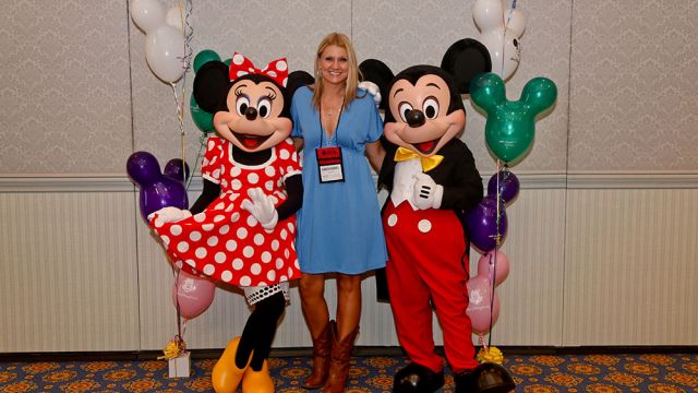 Jennifer is flanked by Minnie and Mickey at Walt Disney World® Resort in Florida, during the MCAA Midyear Meeting