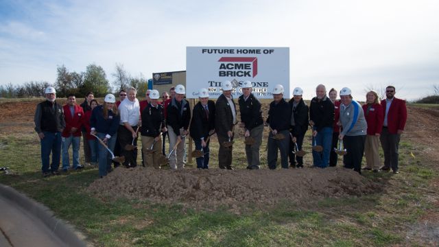 Acme executives including president and CEO Dennis Knautz, joined Springdale Mayor Doug Sprouse and other officials, to turn the first shovels of soil for Acme’s new showroom and warehouse in Springdale, Ark.