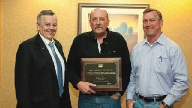 Greg May (center), 2012 winner of Acme Brick’s Plant Manager of the Year award, is shown with Dennis Knautz (left), president and CEO, and Ed Watson (right), senior VP of production for Acme Brick Co.