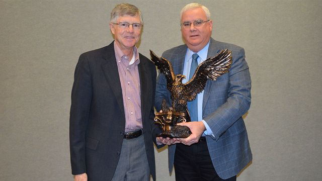Gregg Borchelt (left) is presented with the C. DeWitt Brown Leadman Award by MCAA Chairman John Smith (right)