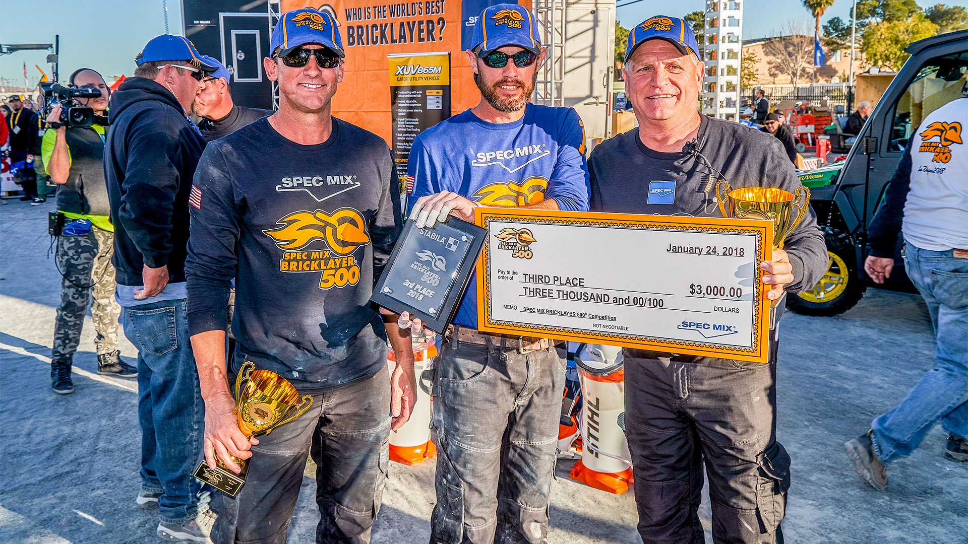 2017 World Champion, Matt Cash (middle), took third place with 658 brick laid. His mason tender Chet Huntley (left) was also returning to defend his Toughest Tender® title from 2017.