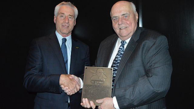 MCAA Chairman Mark Kemp (left) presents Bill Dentinger (right) with the Masonry Hall of Fame plaque