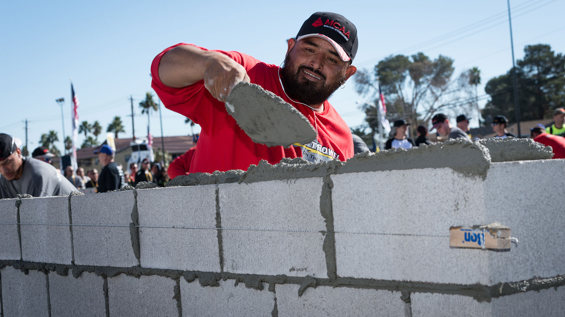 Blocklayer Jose Soto and his mason tender Tomas Quinonez win the MCAA’s Fastest Trowel on the Block with a block count of 126.