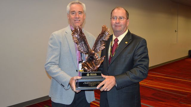 MCAA Chairman Mike Sutter (right) presents Mark Kemp (left) with the C. DeWitt Brown Leadman Award.