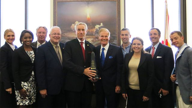Senator Bill Nelson accepts the MCAA Freedom and Prosperity Award from Mark Kemp