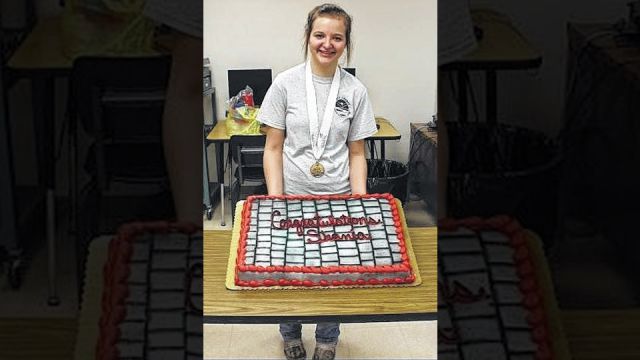 Shania Clifford, celebrating winning gold for the Masonry program at the Skills USA State Competition.
