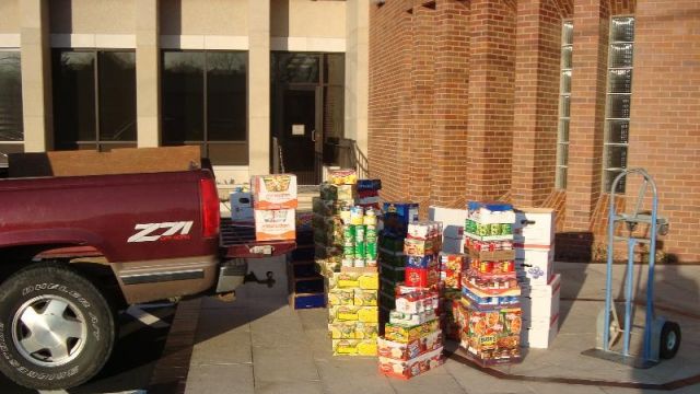 Loading food pantry donations into Dave Gillick's truck in 2012
