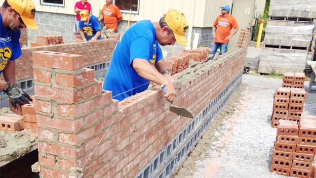 Fred Campbell lays brick at Saturday's East Tennessee Regional Spec Mix Bricklayer 500 competition.