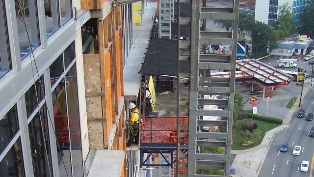 Falling object protection is an important part of mast climbing and scaffolding safety. Image courtesy of EZ Scaffold.