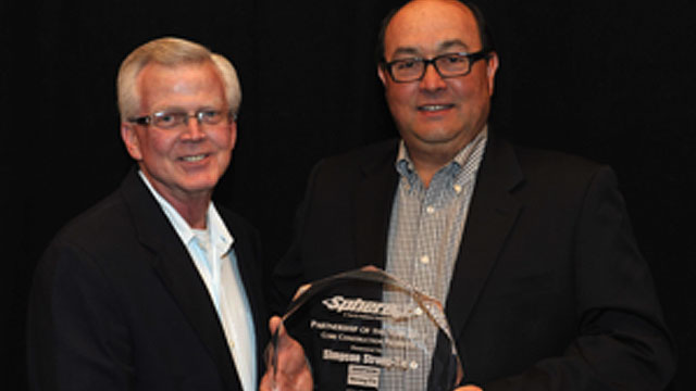 Kent Gilbert and Mike Clemente accept the Sphere 1 Partner of the Year Award on behalf of Simpson Strong-Tie