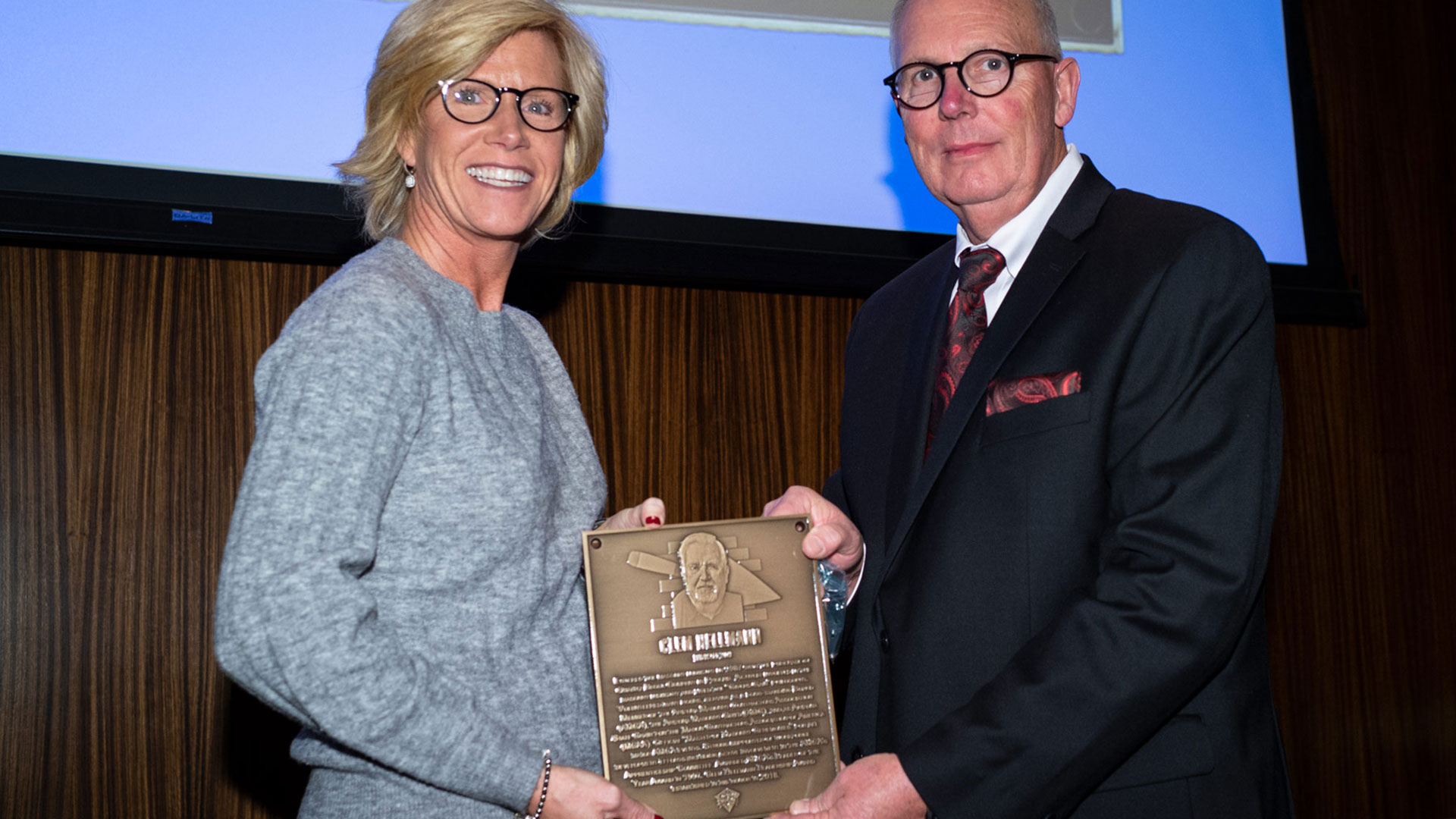 MCAA Chairman Paul Odom (right) presents Jennifer Freiland with Clem Hellmann’s Masonry Hall of Fame plaque.