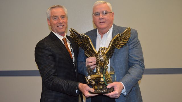 MCAA Chairman Mark Kemp (left) presents John Smith, Jr. (right) with the C. DeWitt Brown Leadman Award