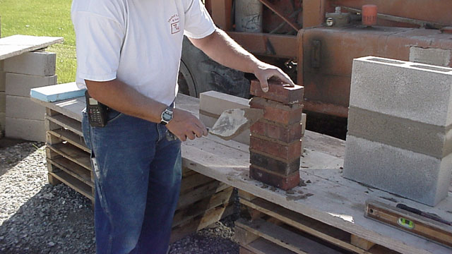 Mortar samples are prepared in job site conditions. After the sample is complete, it is removed from the brick and sent to a testing lab.