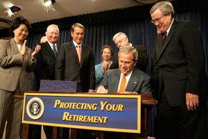 President George W. Bush signs into law H.R. 4, the Pension Protection Act of 2006, Thursday, August 17, 2006. White House photo by Kimberlee Hewitt.
