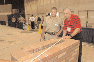 Heath Drye and his instructor, Doug Drye (no relation), evaluate Heaths completed composite project at the 2006 national masonry contest.