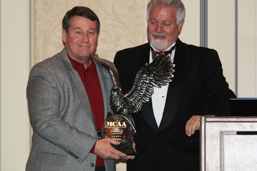 Bill Holden (left) is presented with the 2010 C. DeWitt Brown Leadman Award by MCAA President Tom Daniel (right).