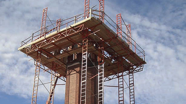 System-type scaffolding can be assembled to fit almost any building shape and hold the heavy weight of brick or stone. Photo courtesy of EZ Scaffold.