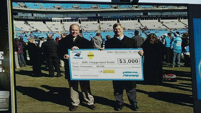 SAKRETE® presents a check to the Carolina Panthers on the Jumbotron at Bank of America Stadium.