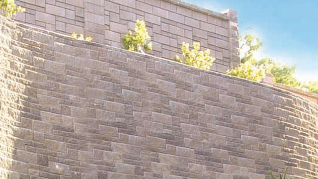 The curve in this retaining wall was constructed using a three-piece block pattern of concrete blocks from Atlas Block.