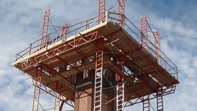 Adjustable scaffolding allows masons to work waist high, the perfect level for maximum production.