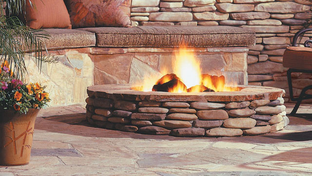 Eldorado outdoor fire pit with gas insert and stone cladding