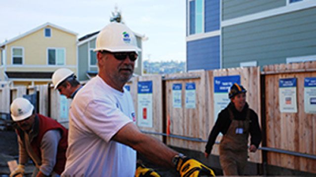 Mike Bugbee, senior vice president for Simpson Strong-Tie, works on a home in Oakland, Calif., during a corporate volunteer day.
