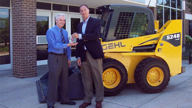 Left to Right: Paul Price, University Wisconsin – Washington County Dean, Dan Miller, CEO Manitou Americas, Inc.