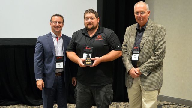 James “Hoss” Hoskinson (center) is presented the MCAA Safety Advantage Award by Jack West (Federated Insurance).