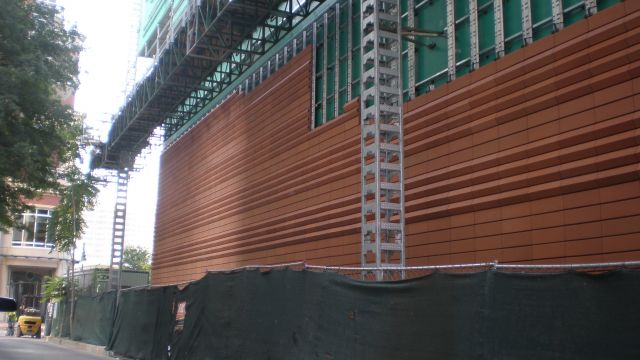 Rainscreen veneer terra cotta during installation.