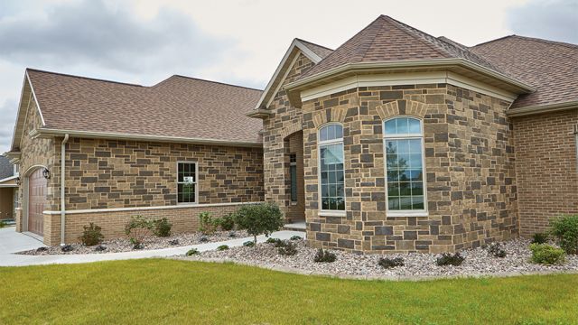 This home features a custom blended pattern of the new Devotion and Promise Reflection Stone Masonry Unit colors.