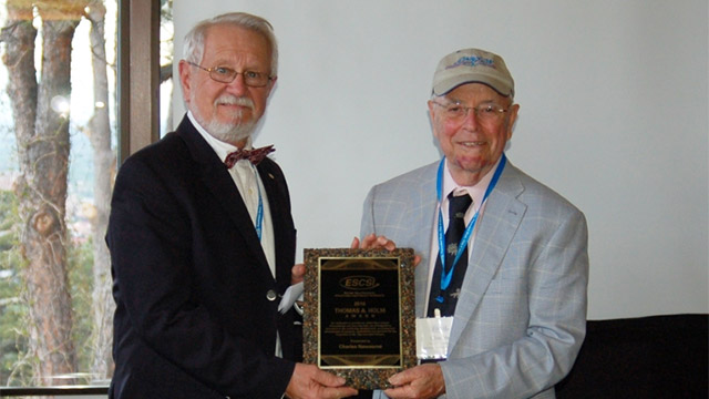 Charles Newsome (right) receives the 2016 Holm Award.