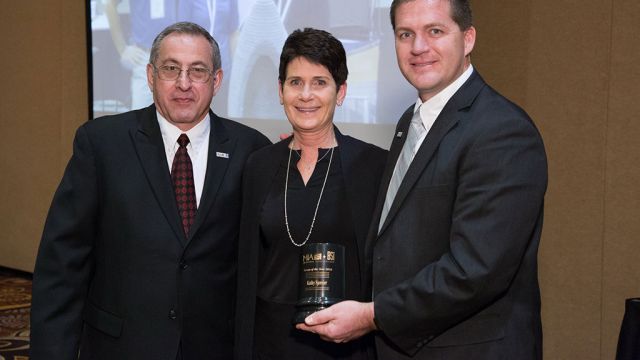 Kathy Spanier with 2016 BSI President Aaron Hicken and 2016 MIA President David Castellucci.