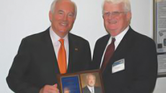 A. Ross Myers accepts Drexel University CMAC's Lifetime Achievement Award from John 
